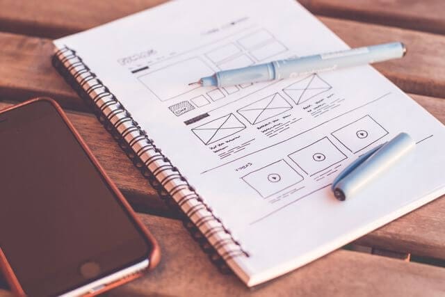 Website wireframe sketches illustrating how to split service pages into focused pages for different services.