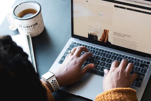 Case studies vs testimonials represented by a business website being viewed on a laptop to help customers assess a company’s credibility.